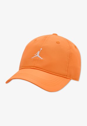 Orange baseball cap with a curved brim and a white silhouette logo of a basketball player jumping with a ball on the front panel.