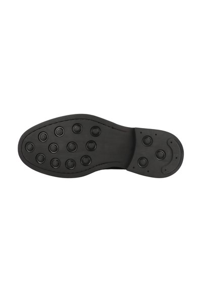 Svart gummisul med rundad form, flera rundade grepppunkter och en slät kant med en subtil böjning vid tån.
