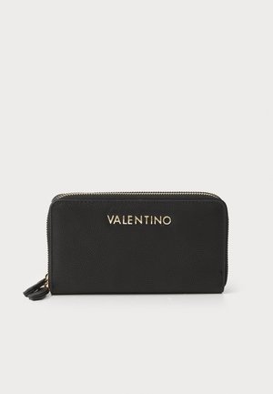 Black leather zip wallet with textured surface, gold embossed "VALENTINO" logo, and zipper hardware. Compact rectangular shape.