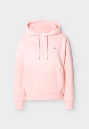 Svetlo rožnata pulover kapa s sprednjim žepom kenguru, z zavezovanjem na kapuci, rebrastimi manšetami in majhnim vezenim logotipom na levi strani prsnega koša.