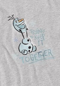 Gray T-shirt featuring a cartoon snowman, with the text “Trying to Keep It Together” in blue, surrounded by snowflake designs.
