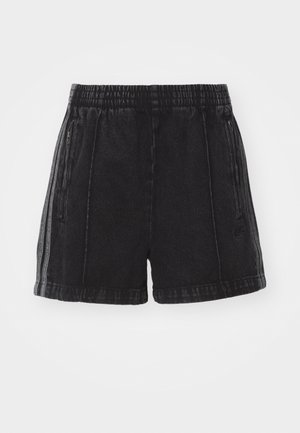 Svarta denimshorts med resårmidja, sidofickor med dragkedja och kontrasterande sidosträck. Sliten textur och längd ovanför knäna.