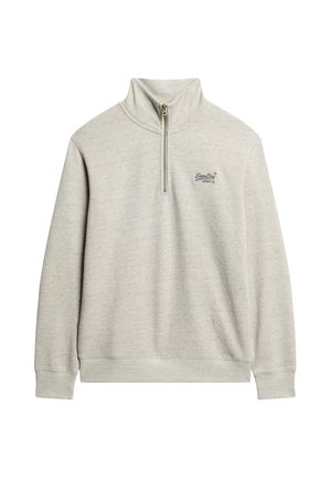 Sudadera con cremallera en gris claro, fabricada en un material suave. Presenta un cuello alto, mangas largas y un pequeño logo en el pecho. Diseño y textura sencillos.