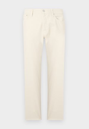 Beżowe spodnie dżinsowe o prostym kroju nogawki, z pięcioma kieszeniami, metalowym guzikiem i subtelną fakturą. Prosty i uniwersalny styl.