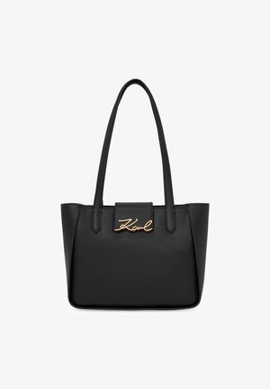 Borsa tote in pelle nera con manici lunghi e logo dorato "Karl" sulla chiusura a linguetta centrale frontale.