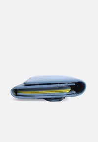 Blue leather wallet with a yellow zipper, featuring a smooth texture and a rounded shape. Contains multiple compartments for organization.