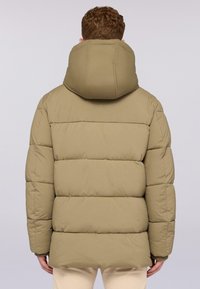 Giacca a vento in khaki con collo alto e design trapuntato. Caratterizzata da una vestibilità rilassata e polsini a coste, realizzata in materiale sintetico liscio.