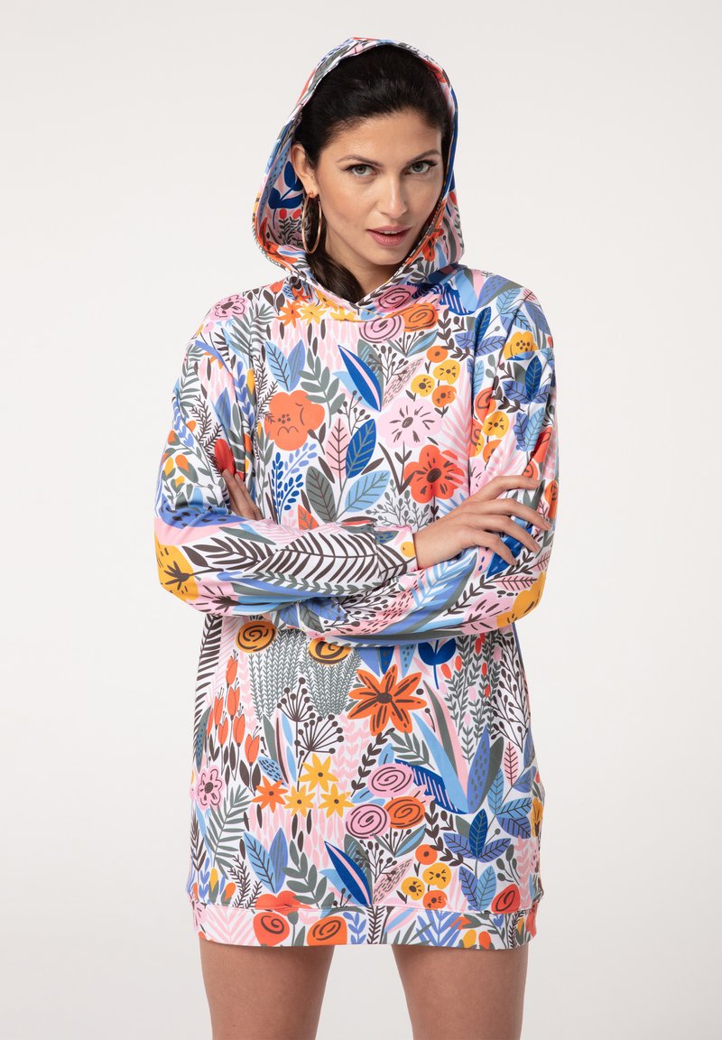 Kapuzenkleid mit einem lebhaften Blumendesign in Pink-, Orange-, Blau- und Grüntönen. Aus weichem, elastischem Stoff gefertigt mit einer entspannten Passform.