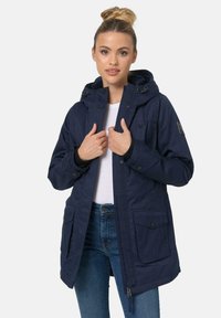 Navy blue parka jacket with a hood, front zipper, snap buttons, and multiple pockets; made of textured fabric with a fitted design.