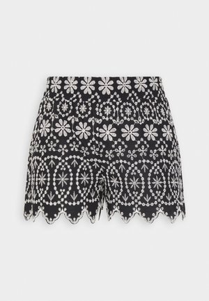 Pantalones cortos negros con bordado floral blanco y detalle de dobladillo ondulado.