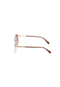 Bruine zonnebril met een gouden metalen frame, ronde lenzen en bruine steunaan. Ontworpen met een strakke, minimalistische esthetiek.