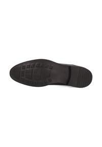 Suola di scarpa nera in materiale gommoso texturizzato, con un motivo di scanalature e tacche per trazione e stabilità.