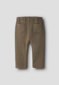 Ribbede olivengrønne bukser med elastisk midje, med to baklommer og smalner mot anklene. Teksturert strikket materiale.