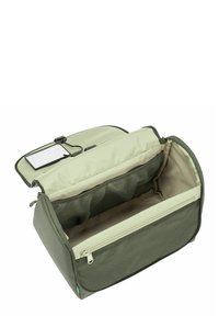 Sac organisateur vert olive avec fermeture éclair, compartiments en maille et intérieur lisse. Équipé d'une fenêtre pour ID transparente sur le rabat supérieur.