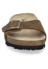 Brown leather slide sandal with a wide strap and metal buckle, featuring a textured cork footbed and black rubber outsole.