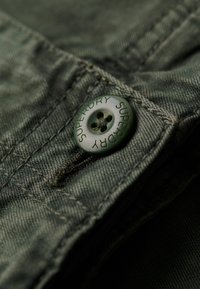 Unselected, surplus goods olive green