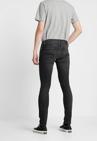 Nudie Jeans Vaqueros pitillo - black denim
