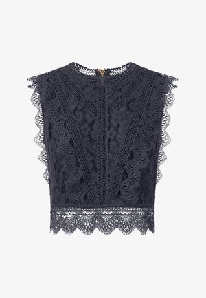Lace crop top in diep marineblauw met golvende randen, intrikate bloempatronen en een ritssluiting aan de achterkant. Zachte textuur benadrukt de ontwerpdetails.