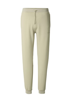 Světlé zelené tepláky s elastickým pasem, stahovací šňůrkou a žebrovanými manžetami; vyrobené z měkké látky s hladkým povrchem.