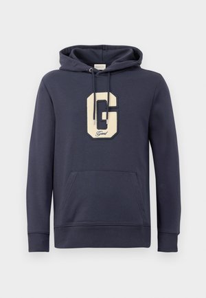 Dunkelblauer Kapuzenpullover aus Baumwollmischgewebe, mit einem großen cremefarbenen "G"-Logo mit Stickerei und einer Fronttasche.