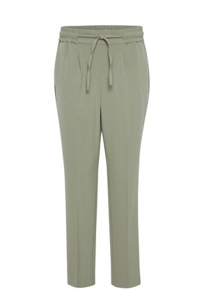 Pantalons de jogging vert clair avec une taille élastique, cordon de serrage ajustable, poches latérales et une coupe fuselée. Texture de tissu lisse.