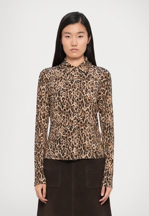 Leopard print long-sleeve shirt made of a smooth, stretchy fabric; features a classic collar, button-down front, and fitted silhouette.