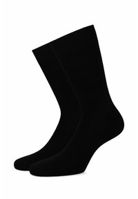 Czarne skarpetki wykonane z gładkiego, elastycznego materiału. Mają długość do kostki, wzmocnioną piętę i palce, prezentując prosty wzór.