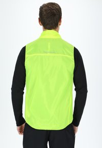 Swedemount PACKABLE WIND - Bodywarmer - neon