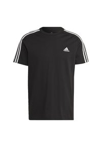 T-shirt in cotone nero con collo rotondo, maniche corte e tre strisce bianche sulle spalle. Piccolo logo adidas bianco sul petto.