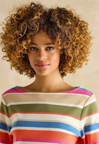 Multicolored striped sweater featuring horizontal lines in cream, green, pink, blue, and orange. Soft knit fabric with wide neckline.