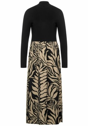 Robe longue à col roulé à manches longues noire avec jupe à motifs abstraits de feuilles beige et noire, cintrée à la taille, style longue.