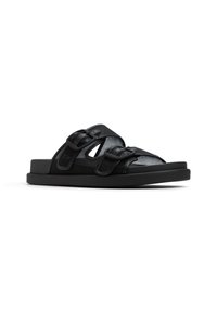 Svarta sandaler med en ovandel i mesh, dubbla justerbara remmar, platt sula och en minimalistisk design. Lämpliga för avslappnad användning.