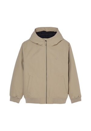 Veste beige à capuche avec fermeture éclair, manches longues, deux poches avant, poignets côtelés et petit logo rond sur la poitrine.