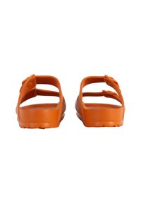 Orange slide sandals with a textured footbed, open design, and two adjustable straps. Made of flexible rubber material.