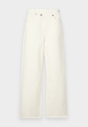 Szerokie, kremowe dżinsy wykonane z denimu, z wysokim stanem, pięcioma kieszeniami i surowym dołem, zapewniające luźny fason.