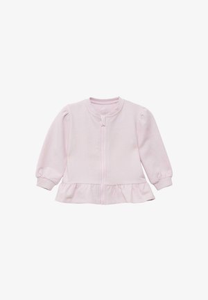 Jasnoróżowy kardigan wykonany z miękkiej tkaniny, z zamkiem błyskawicznym, bufkami na rękawach oraz rozszerzanym dołem wykończonym falbanką.