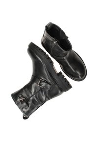 Zwarte leren enkelboots met een gladde bovenkant, decoratieve gespen en robuuste rubberen zolen met een gestructureerde grip. Ritsluiting op één paar.