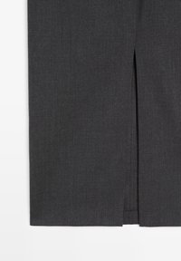 Dark gray fabric with a central vertical slit detail near the bottom edge, showing layered material underneath.
