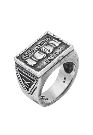 Rectangular silver ring with textured surface, featuring engraved hands and the phrase "Good Things Last." Intricate accents on the band.