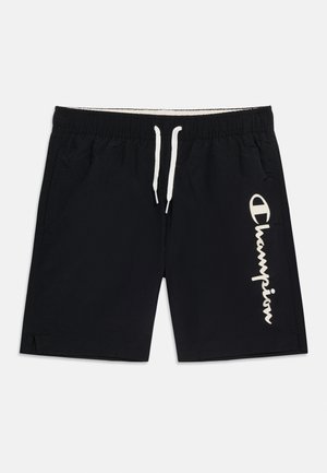 Black athletic shorts with white drawstring waistband and white "Champion" logo printed vertically on the right leg.