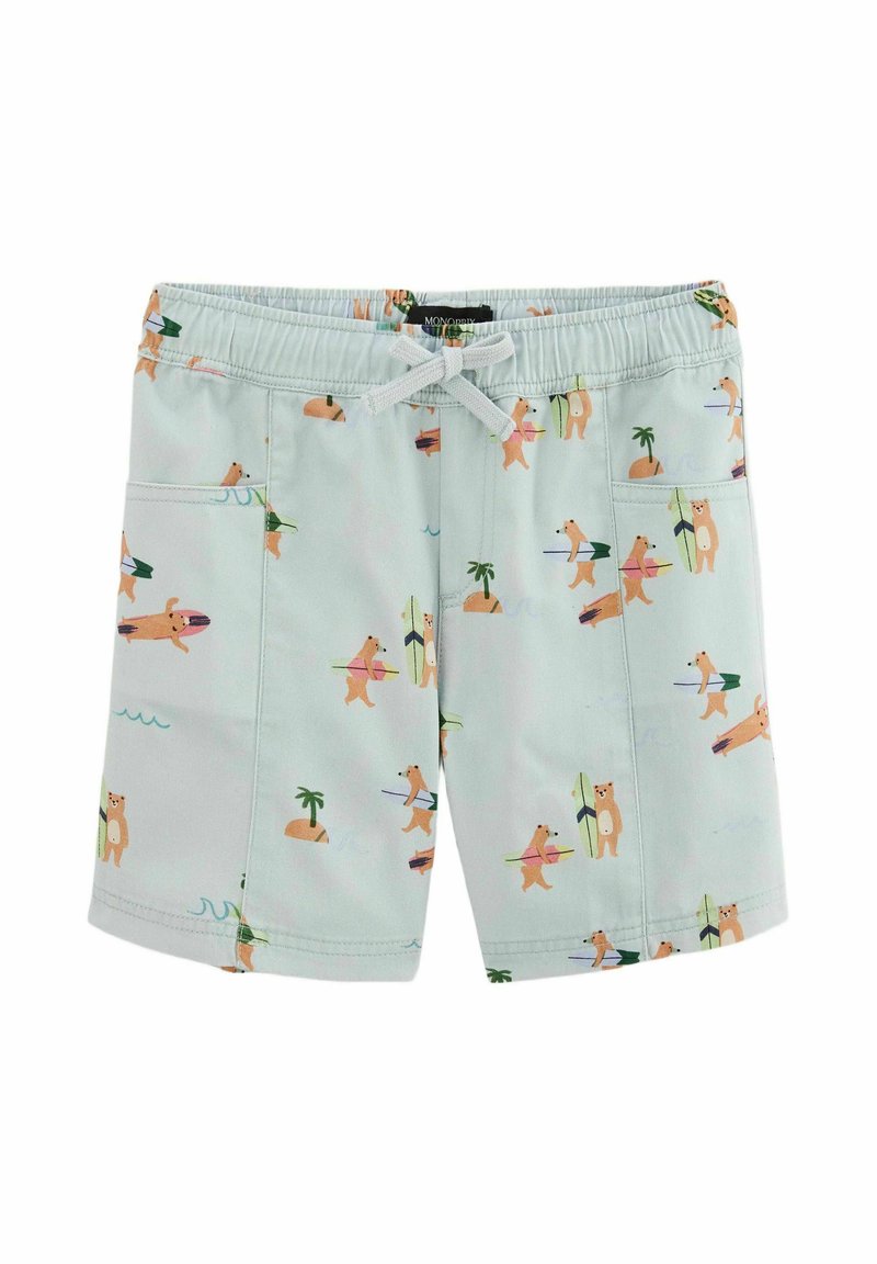 Shorts de bain vert clair avec un imprimé ours et planche de surf, dotés d'une taille élastique, d'un cordon de serrage et de deux poches latérales.