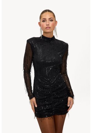 Zwart mini-jurkje met lange, doorschijnende mouwen, versierd met pailletten en franjeranden. Gestructureerd, nauwsluitend bodycon-ontwerp. Hoge halslijn.