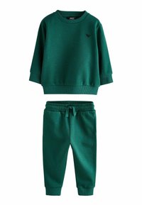 Ensemble vert en deux pièces comprenant un sweat-shirt à col rond à manches longues et un pantalon de jogging assorti avec une taille élastique.