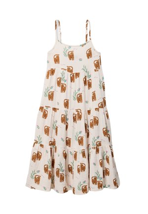 Robe blanche sans manches avec fines bretelles, décorée d'imprimés léopard marron et de motifs végétaux verts dans un design à étages et fluide.