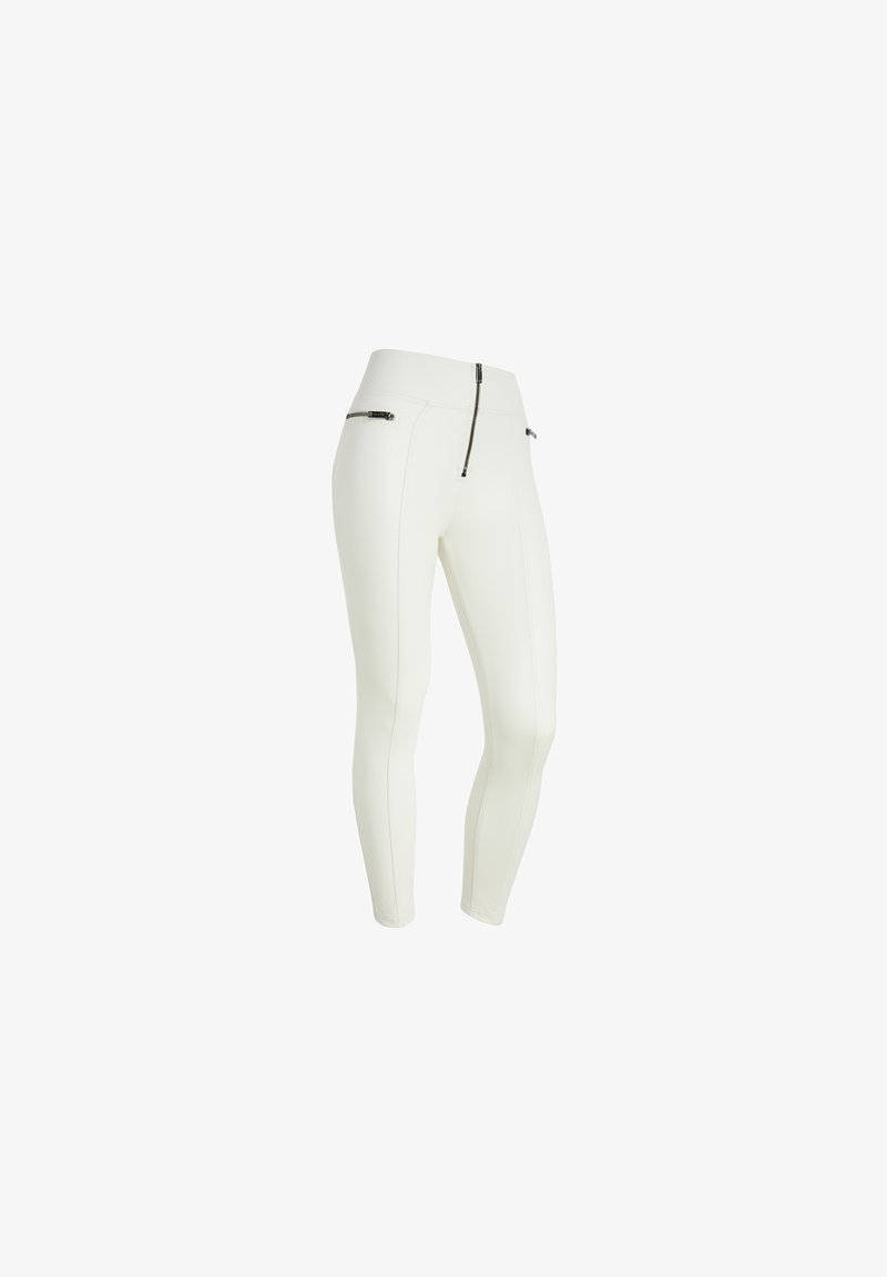 Leggings blancos de diseño ceñido, con cremallera frontal y dos bolsillos con cremallera en las caderas. Textura suave y estilo minimalista.