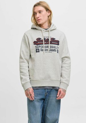Gray hooded sweatshirt with a front graphic in dark red and black text. Made of soft material, featuring a kangaroo pocket and ribbed hem.