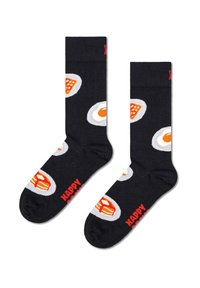 Czarne skarpetki z powtarzającym się wzorem jajka w białym i pomarańczowym kolorze, z napisem "HAPPY SOCKS" w czerwonym na strefie palców. Miękka tekstura.