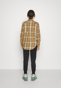 The North Face Träningsbyxor - black