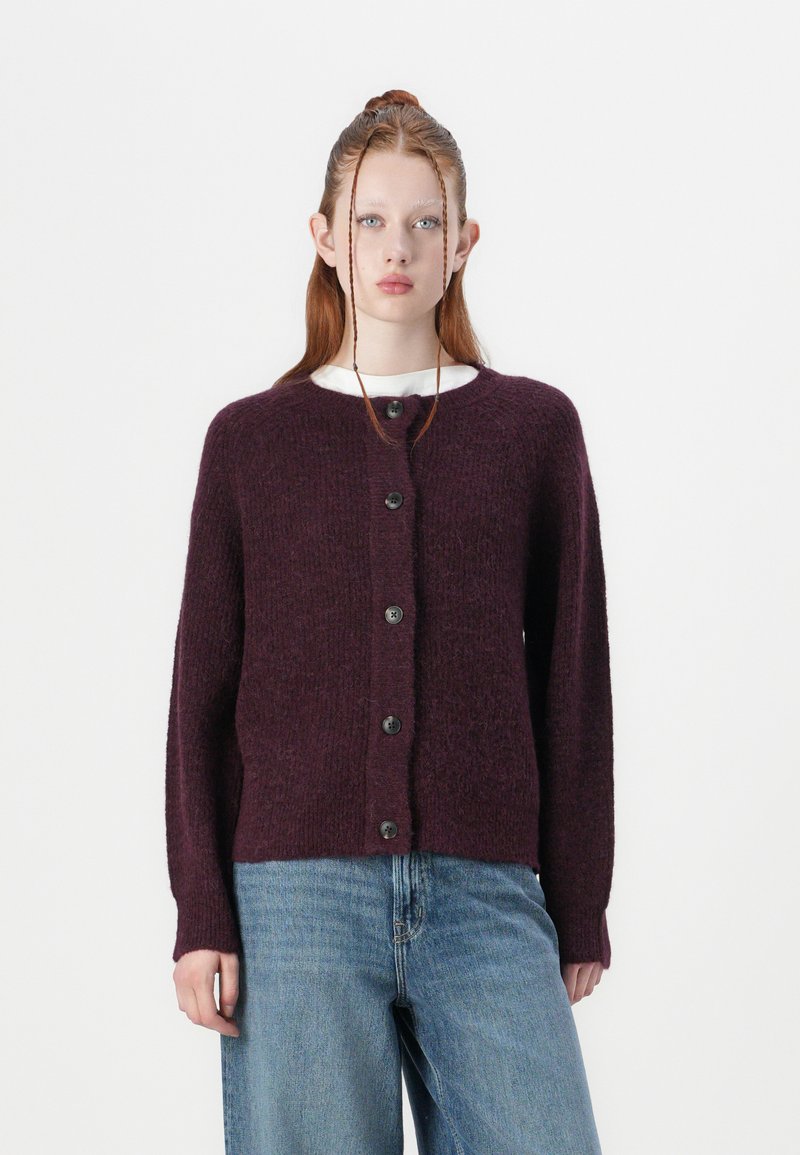 Burgundy knit cardigan with a textured finish, round neck, and front button closure. Features long sleeves and a relaxed fit.
