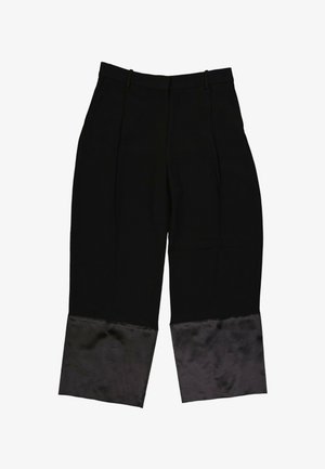 Pantalon noir à jambes larges, taille haute et larges poignets à finition satinée à l'ourlet.